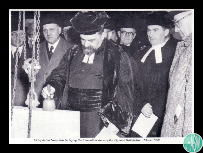 Black and white photograph of Chief Rabbi Israel Brodie laying the