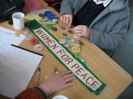 Collection of badges and a 'Women for...