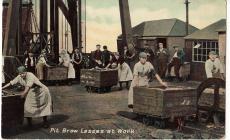 Postcard showing pit brow lasses at work