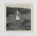 Gladys Postings gathering the hay