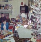 A brother and sister opening Christmas presents...