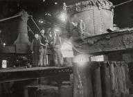 Cyfarthfa Works, casting an ingot, early 20th...