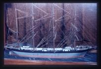 Model of an unidentified ship in glass case