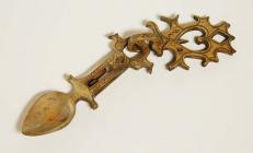 A pearwood lovespoon inscribed with the date, 1821