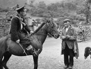 The postman arrives at Cwm Berwyn where his is...