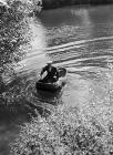 Man with his coracle on the river Teifi, near...