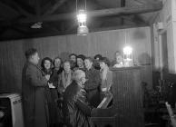 Choir practising in darkness in Llanfachreth...