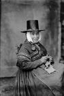 Mrs Edwards knitting in Welsh national dress, c...