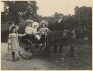 Charles Jones, his children and a donkey cart,...