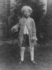 Boy in period costume, c. 1900