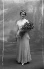Full length bridal portrait of a young woman,...