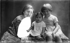 Portrait photograph of a mother and children, c...