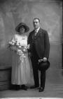 Portrait photograph of a bride and groom, c.193...