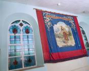 Banner and stained glass windows of Tabernacl...