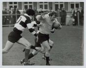 A charging run by Lyn Jones, captain of Cardiff...