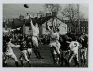 Swansea's Mervyn Davies leaps for the ball...