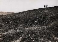 Three men survey the fallen tip at Aberfan, 1966