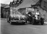 Llangollen. Two cars in the carnival outside...