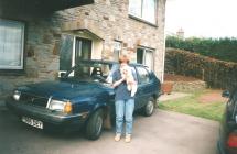 Young woman next to Volvo