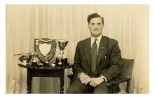 Lloyd Jones with trophies for public speaking,...