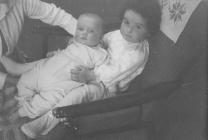 Two young children on chair