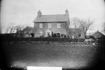 Lewis family in front of house