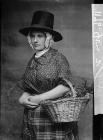 woman in national dress carryig a basket (Jones)