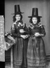 Two women in national dress drinking tea (Jones)