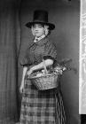 woman in national dress with a basket of...