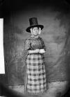 woman in national dress and drinking tea