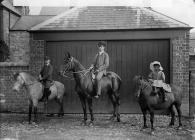 Three people riding horses (Morris)