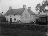 Two women outside a house