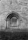 Door with writing carved into it