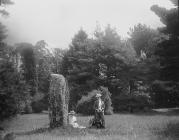 Two ladies by a standing stone