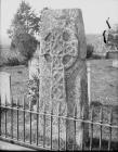 Celtic cross situated in a churchyard at Llowes