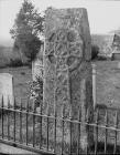 Celtic cross situated in a churchyard at Llowes