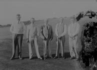 Five gentlemen golfers on the golf course