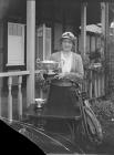 Lady holding a cup outside Llandrindod Wells...
