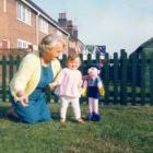 Grandmother and grandchild wih her toy