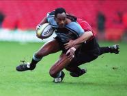 Nigel Walker tackled by Phillippe Carbonneau,...