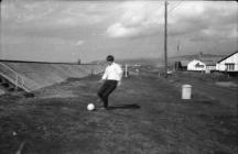 Playing football near golf course