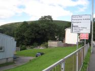 Richard Price Centre, Llangeinor and road sign,...