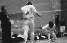 Aberystwyth fencer in an epee bout at the...