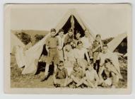 Group of boys outside tent