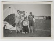 4 men next to tent