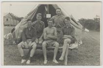 5 men in front of tent