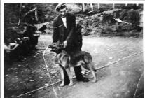 Quarryman, Tom Rowlands with his dog Prince.