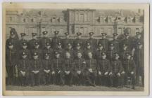 Group of men in uniform including Tom Wibberley...