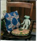 Cushions and teddy made from Laura Ashley material