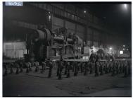 Workers with steel sheets at the works, Port...